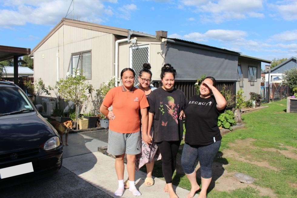 Jane and daughters outside their Habitat house in Hamilton,