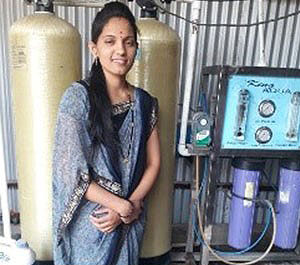Mohini and reverse osmosis water facility at her home in Ind