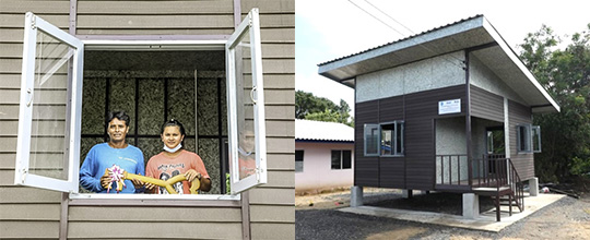 Praphan and his daughter at their upcycled house in Thailand