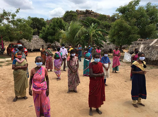 Irulas waiting to receive hygiene kits from Habitat India